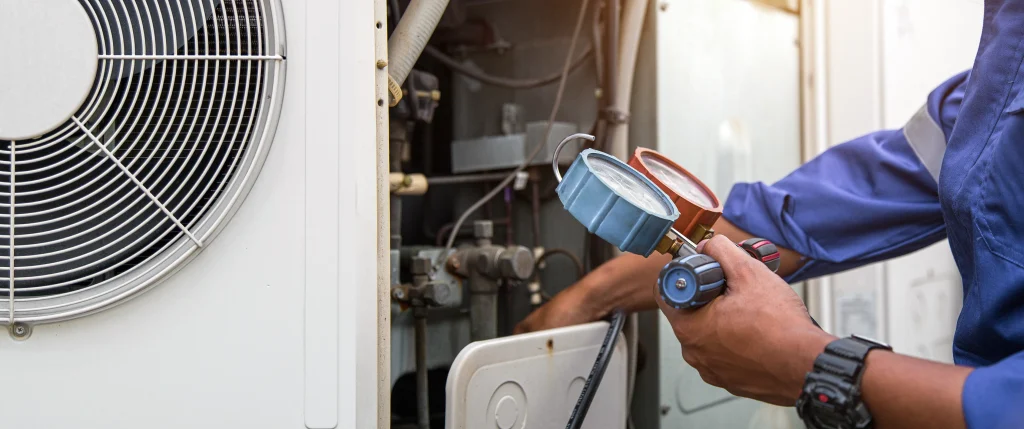 Engineer checking HVAC system pressure during clean air validation
