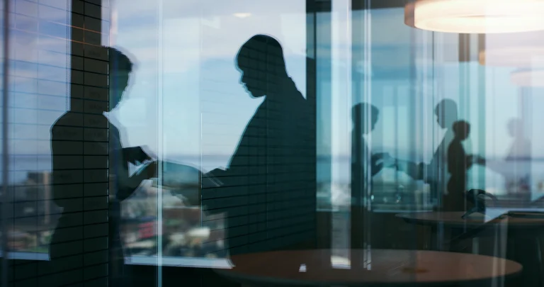 Engineering professionals collaborating in a modern office environment