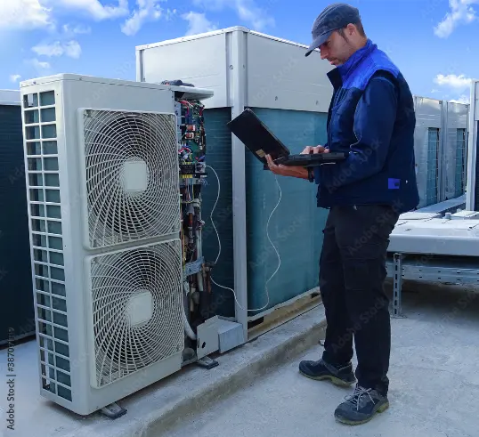HVAC engineer inspecting ventilation ductwork in a commercial building